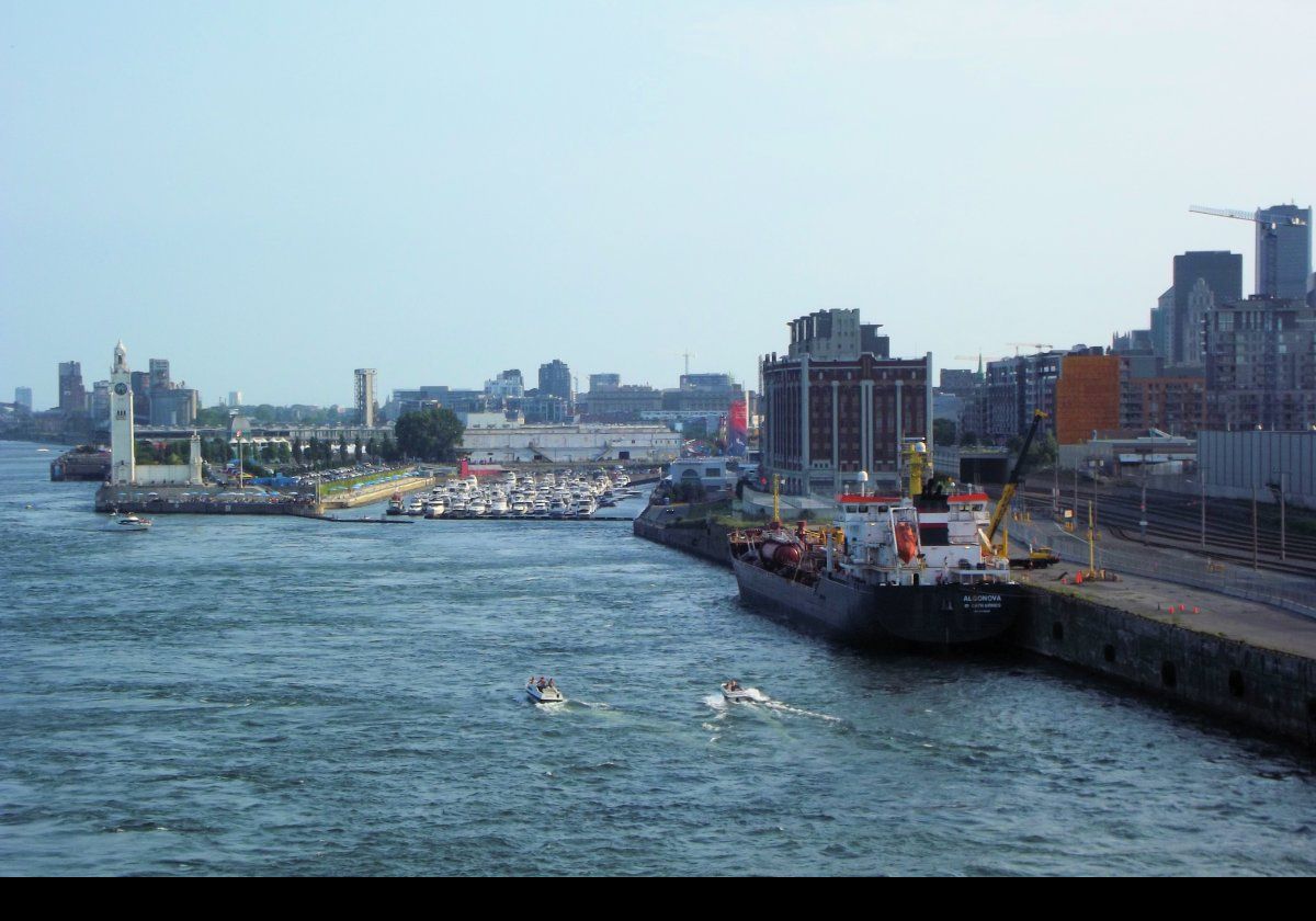 Small boats in the Bassin de l'Horloge.  On the extreme left is the Montreal Clock Tower (or Tour de l'Horloge) built between 1919 & 1922 as a memorial to the Canadian sailors who died in the First World War.  The clock was constructed in England using a similar movement to that of the clock in the Palace of Westminster.