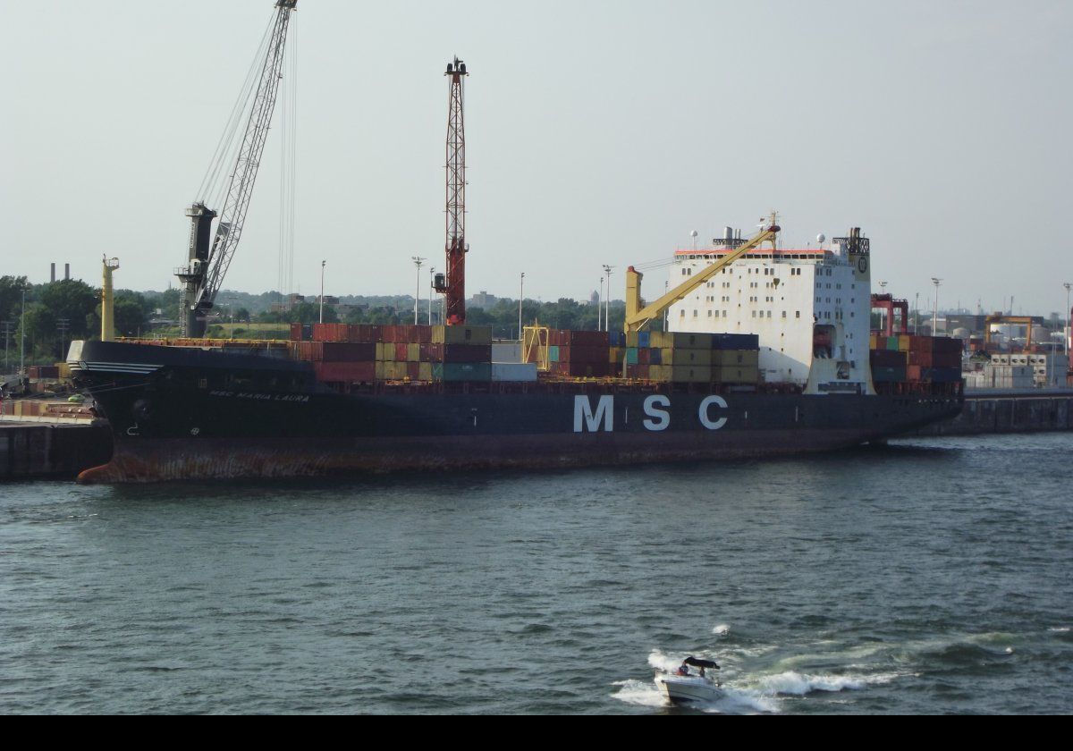 Commercial vessels moored along the various berths in the port.