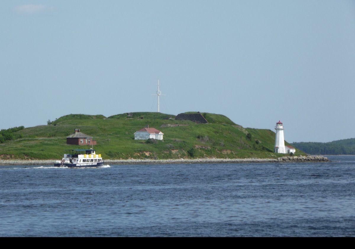 Named after King George II, the current Georges Island Lighthouse was built in 1917 replacing an earlier one built in 1876 that burned down in 1916. The keeper's house from 1917 remains standing.  A 4th order Fresnel lens was mounted in the old lantern room in 1913.  A 270° degree 4th order Fresnel lens was used in the new lighthouse, and it was automated in 1972.