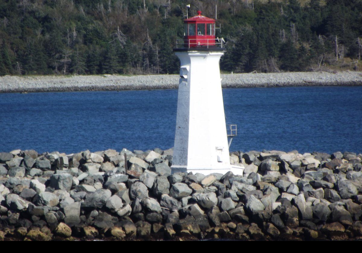 The Maugher Beach (McNabs Island) Lighthouse.  The present structure replaced an earlier Martello tower in about 1941.  It used the third-order Fresnel lens from the earlier tower.  The lighthouse was automated in 1983.