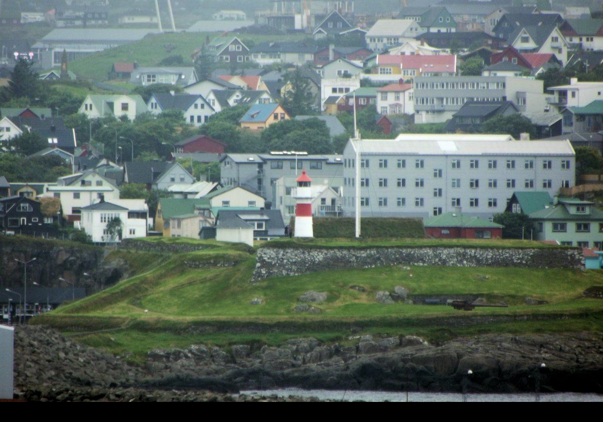 Skansin Lighthouse above the Skansin fortress. The lighthouse dates to 1888, while the fortress was built in 1580 by Magnus Heinason as protection from roving pirates.