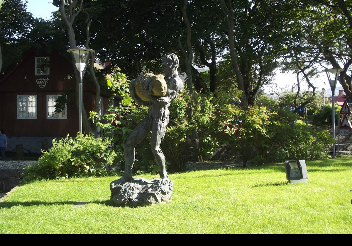 "Tradarmadurin"; a 1989 bronze sculpture by Hans Pauli Olsen.  He is a Faroese sculptor now based in Denmark.