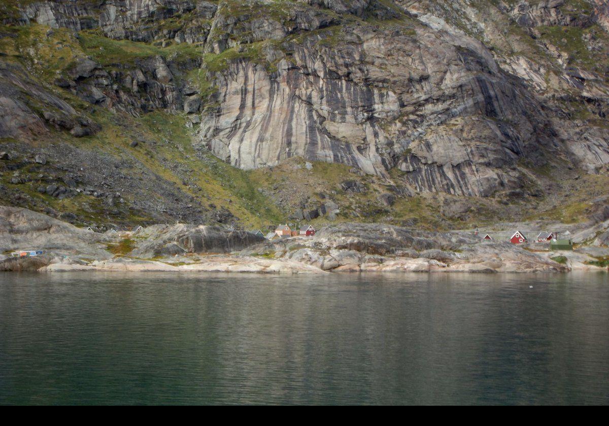 Aappilattoq village, meaning "sea anemone" in Greenlandic. Essentially inaccessible via land due to the surrounding mountains, and iced in for most of the year, the heliport is their vital link to the outside world.