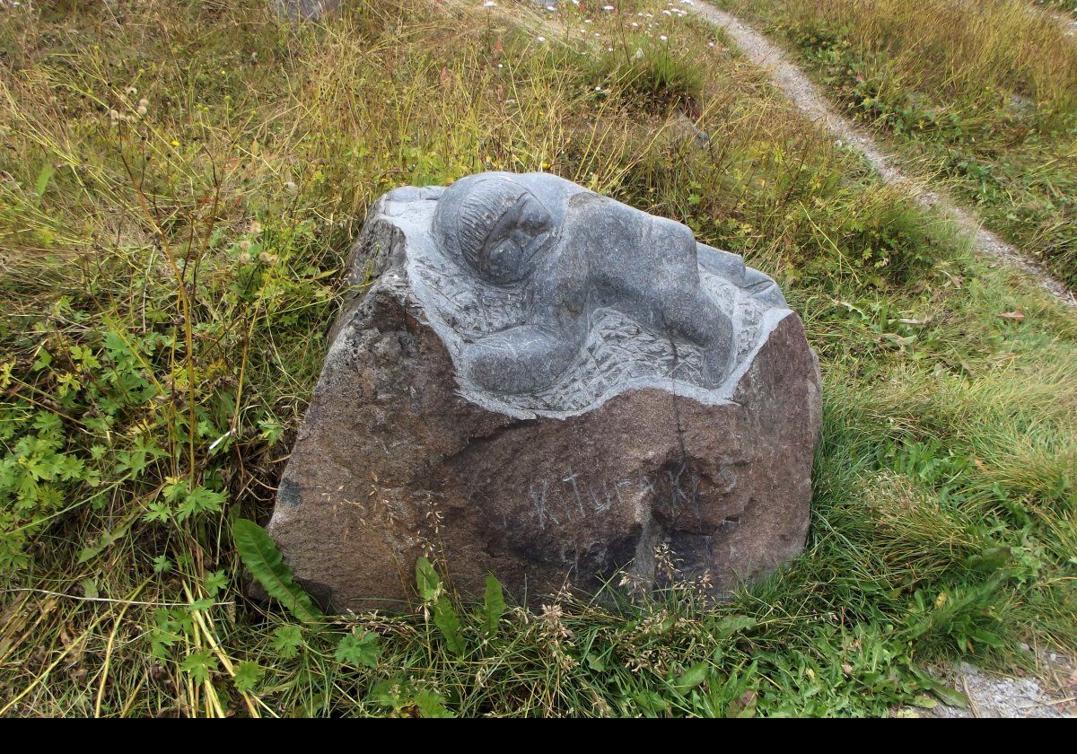 These pictures are of sculptures from the Stone & Man Project. 18 artists carved 24 sculptures into boulders & rock faces in the town between 1993 & 1994. This continued, and today there are more than 40 statues around the town.