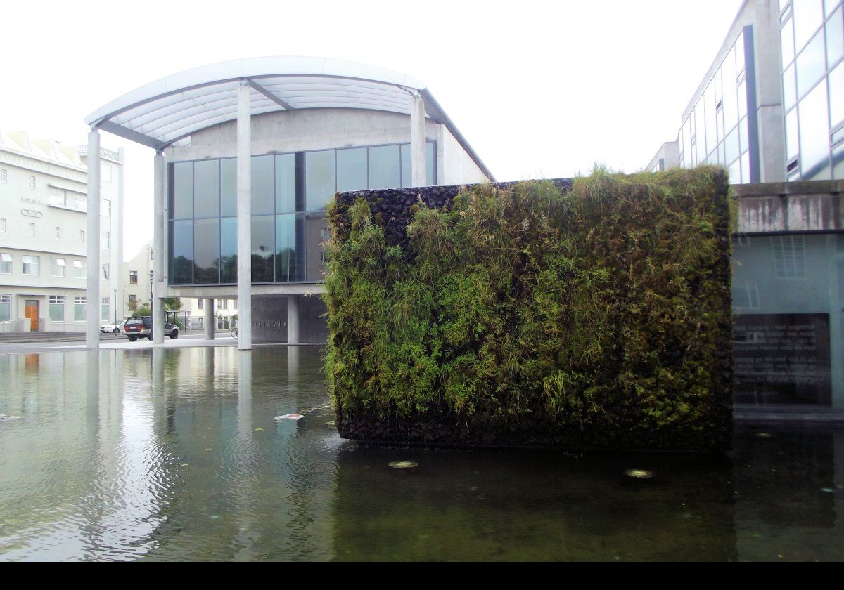 A water and plant feature adjacent to another entrance to City Hall.