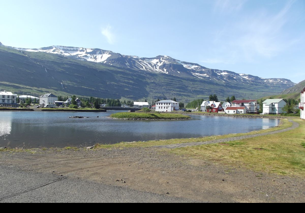 Another view of the small island in the Fjarðará lake .