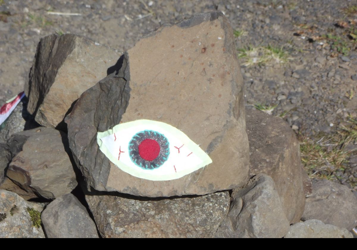 A colorful sculpture on the side of the road. Closeup on a single eye!