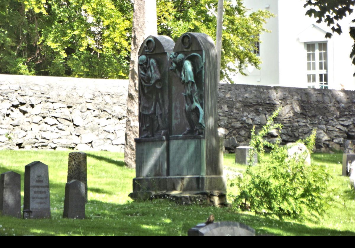 Grave stones and monuments in the graveyard of Alesund Church.