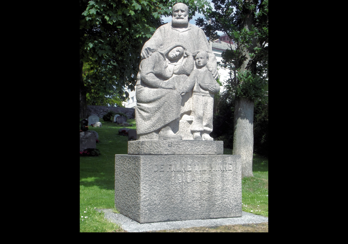A World War 2 Memorial in the grounds of Alesund Church.  Sculpted in granite, it represents a family who have lost someone in the war.  It stands about 2.5 meters (8 feet) tall.  The inscription reads "De Falne Till Minne (In Memory of the fallen) 1940 to 1945.  