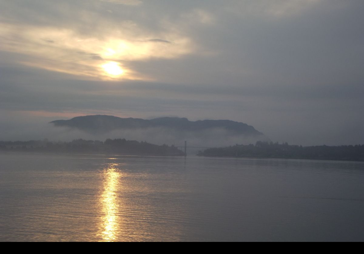 Early morning approach to Bergen. Bergen is known as the "city of seven mountains", and is the second largest city in Norway.