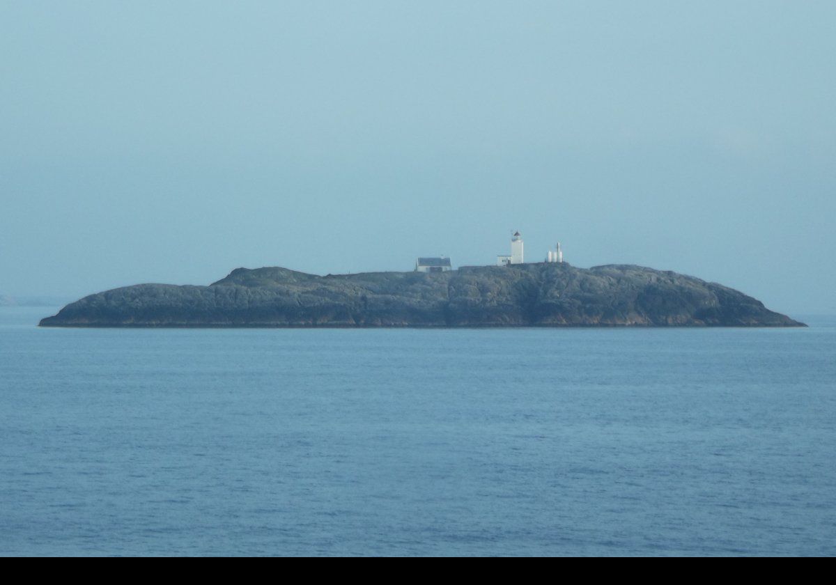 Located on the island of Store Marstein, just west of the island of Stora Kalsøy, the Marstein Lighthouse is a 17-metre (56 ft) tall square, white, tower with a lantern room. It is attached to a small maintenance building. Built between 1949 & 1950, it replaced an octagonal shaped lighthouse dating from 1877.