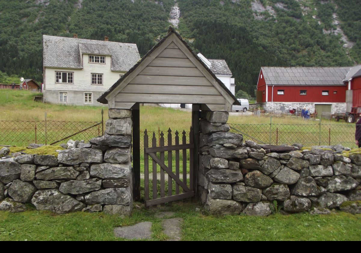 An entry gate in the old stone wall surrounding the church graveyard.