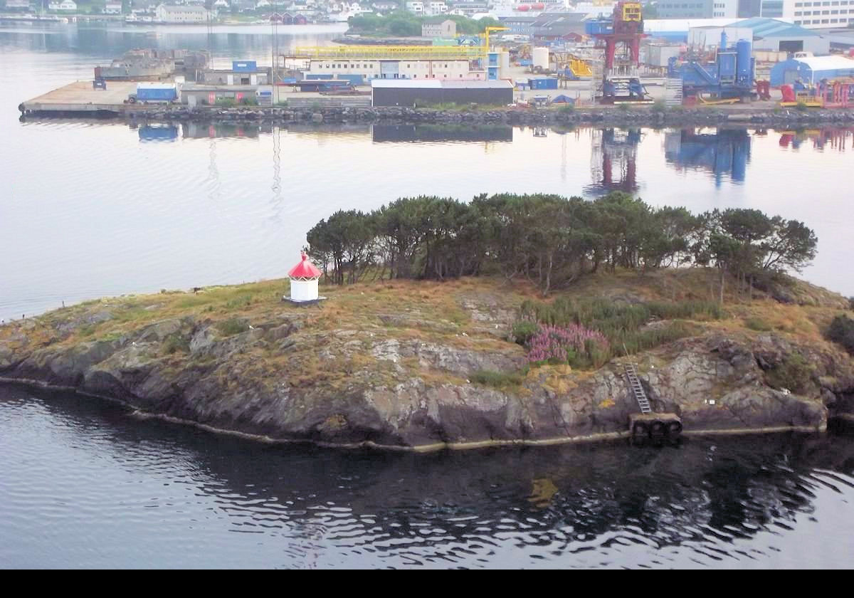 The little Tjuvholmen lighthouse on Tjuvholmen island about a half mile (800 meters) from the waterfront in Stavanger. It is one of three lighthouses in Norway called Tjuvholmen, that I believe translates to "Thief Island".