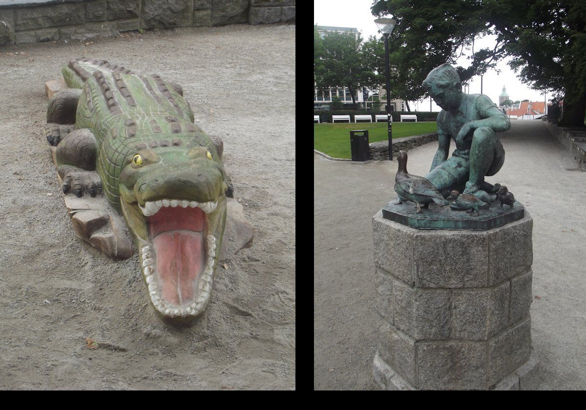 Not sure about the crocodile, by on the right is 'Gutten og Andemor' (The Boy and the Mother Duck) a sculpture by Erik Haugland.