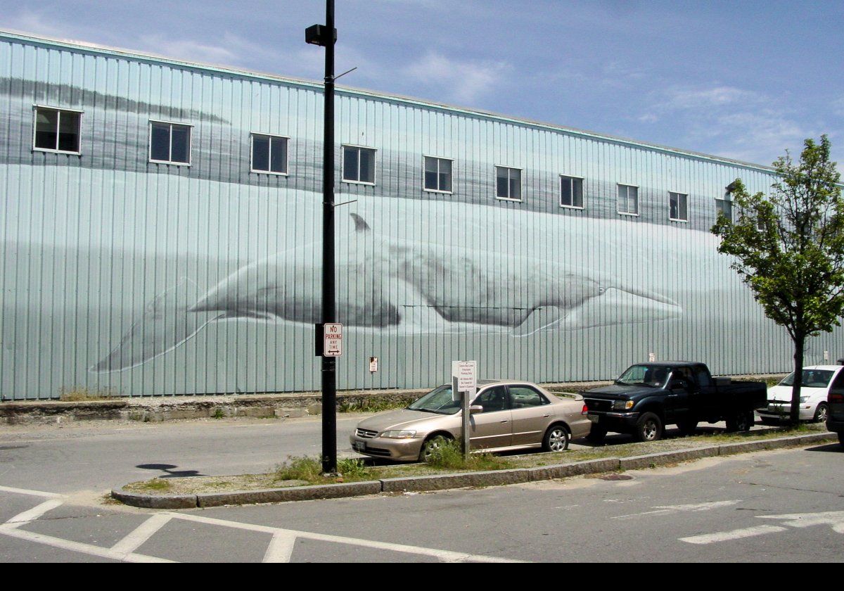 One of the Whaling Wall murals by the artist Wyland (Robert Wyland). On the side of the Marine State Pier, this one is number WW 36 “Whales off the Coast of Maine”. It is 1,000 feet long and was dedicated on June 7th, 1993.