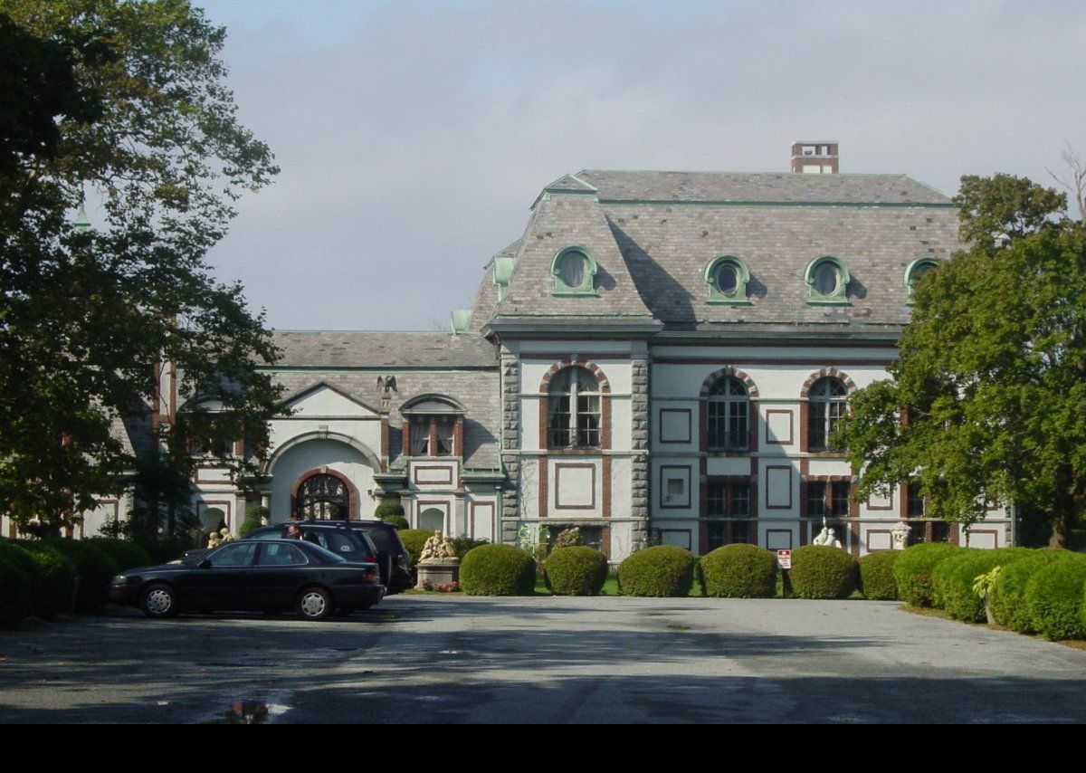 As built, it had 60 rooms in 50,000 square feet,but had only one bedroom and bathroom.  Belmont did not appreciate overnight guests.  It cost $3.2 million to build, equivalent to over 70 million in 2009.  An inveterate snob, Belmont considered most of his neighbors on Bellevue Avenue to be nouveau riche, so placed the main entrance on the opposite side from Bellevue on Ledge Road, thus turning his back on the nouveau riche.  