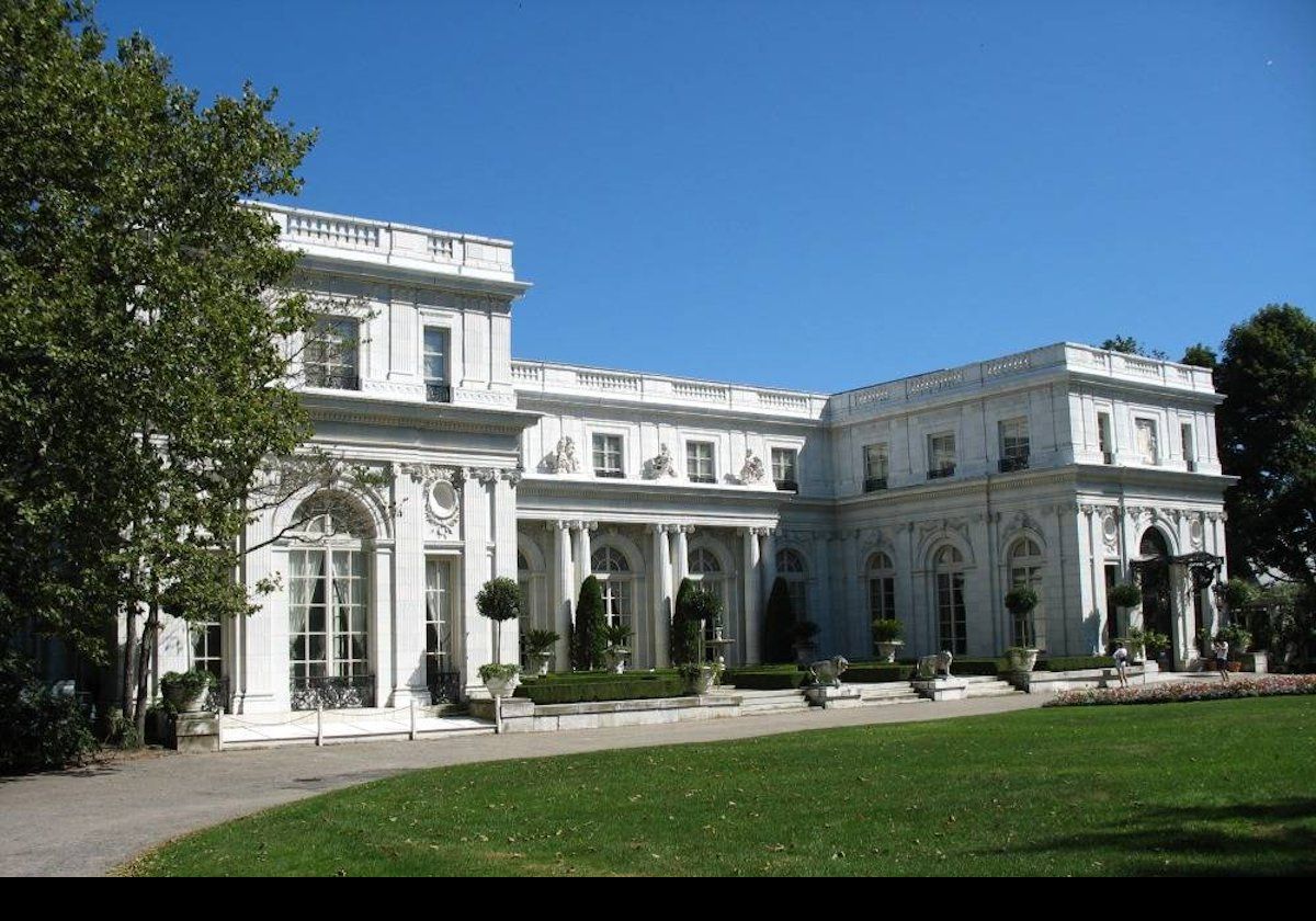 The front facade of the house.  The main entrance is on the right hand side.  Construction of Rosecliff, built for Theresa Fair Oelrichs, started in 1899 and was not completed until 1902.  The main architect was Stanford White, who apparently modeled it after the Grand Trianon of Versailles but with a second main floor, and on a simplified and much smaller scale.  