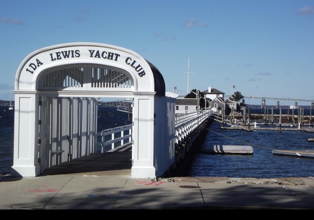 These pictures show the Ida Lewis Yatch Club which is named for a famous Newport lighthouse keeper who was often called the "bravest Woman in America" for her amazing rescues. The Lime Rock lighthouse was re-named the Ida Lewis Light in her honor. The lighthouse is now the clubhouse of the yatch club, and is seen at the end of the pier.