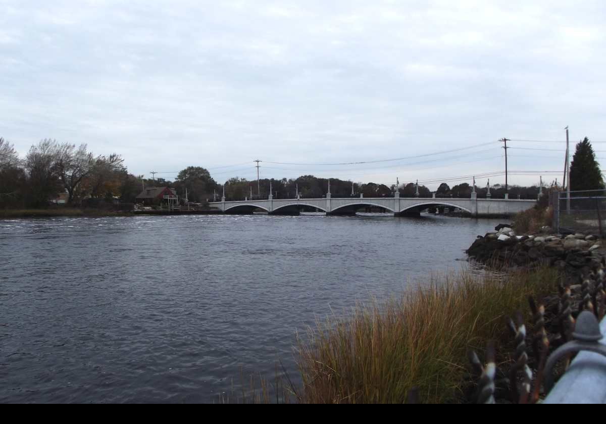 The area around what is now Warren was first explored and settled around the 1620s and 1630s. Massachusetts ceded the town to Rhode Island in 1747. View across the Palmer River. Built in 1914 with three arches, the Palmer River Bridge was replaced recently with this handsome new four arch bridge. Appearance is very similar to the old bridge.