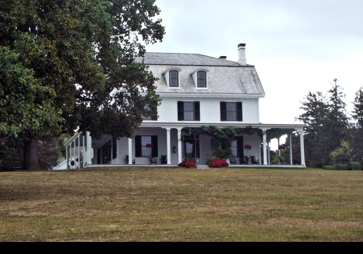 Thomas E. Brayton purchased this seven acre estate in 1872. At that time, the white clapboard house had been built and it was run as a small farm.