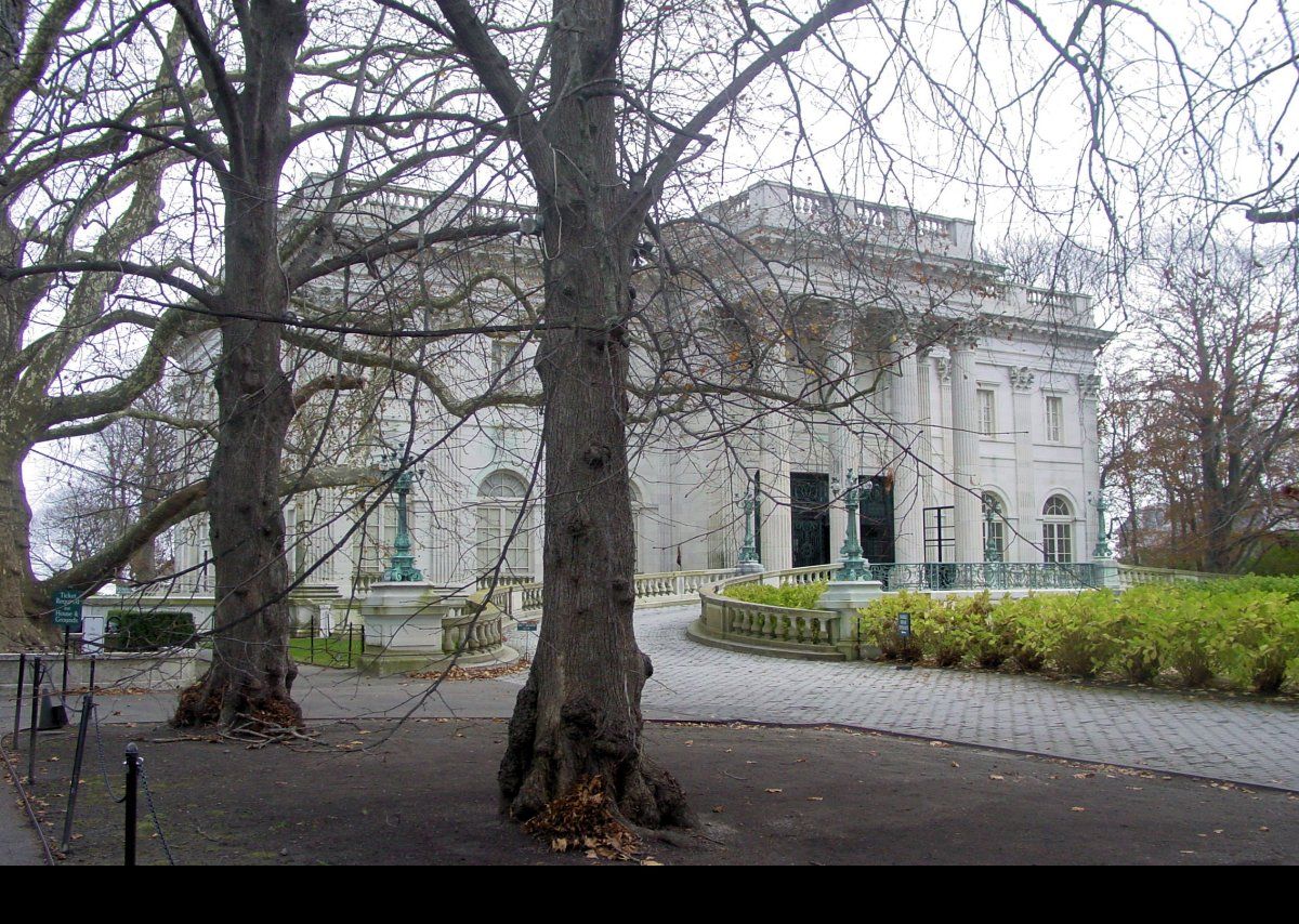 The columns are reminiscent of those on the White House. Vanderbilt gave The Marble House to his then wife Alva Erskine Smith for her 39th birthday in January 1892. She was from a wealthy southern family, and had spent the civil war years living in Paris, as had many wealthy southern families. She divorced Vanderbilt in 1895, marrying Oliver Hazard Perry Belmont, and moved into his house Belcourt. Belcourt did not have the closet space necessary for her clothes, so The Marble House was used as a repository for her clothes.