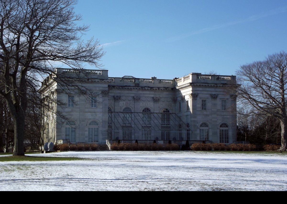 The rear facade that faces towards the sea. In 1909, she opened the Marble House to the public to help raise awareness for the women's suffrage movement, charging $1 to visit the grounds and $5 for the house’s interior; so not many of the "general public" could have afforded it. She moved to France in the early 1920s, and in 1932, she sold the house to the wealthy financier Frederick H. Prince. She died in Paris in January of 1933. Parts of both the Great Gatsby and True Lies were filmed in the Marble House, with other parts filmed at Rosecliff.