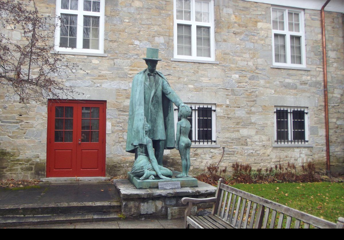 Clyde du Vernet Hunt had already produced two statues in 1918: "Nirvana", a seated nude woman, and "Fils de France", a nude boy. In 1920, he produced a statue of Abraham Linoln. In 1928, he combined reworked versions of these to produce the Lincoln Trilogy. In 1947, the artist’s heirs donated the piece to the Bennington Museum when it was re-titled "Lincoln Trilogy (The American Spirit)".