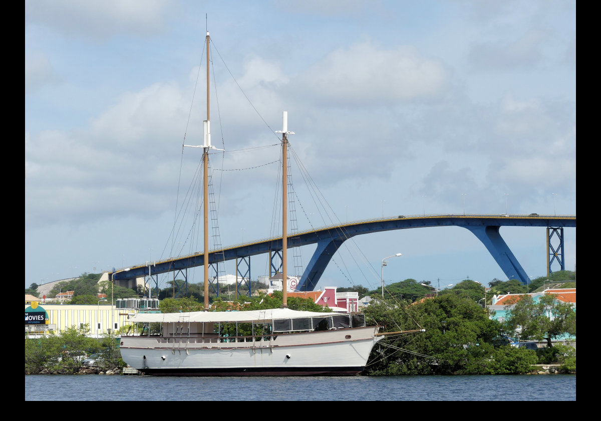 Queen Juliana Bridge or Koningin Julianabrug, is a bridge across St. Anna Bay.  It opened on 30 April 1974 and, at its maximum, is 56.4 meters (185 feet above the water allowing large ships to pass.  It comprises 4 lanes of traffic.