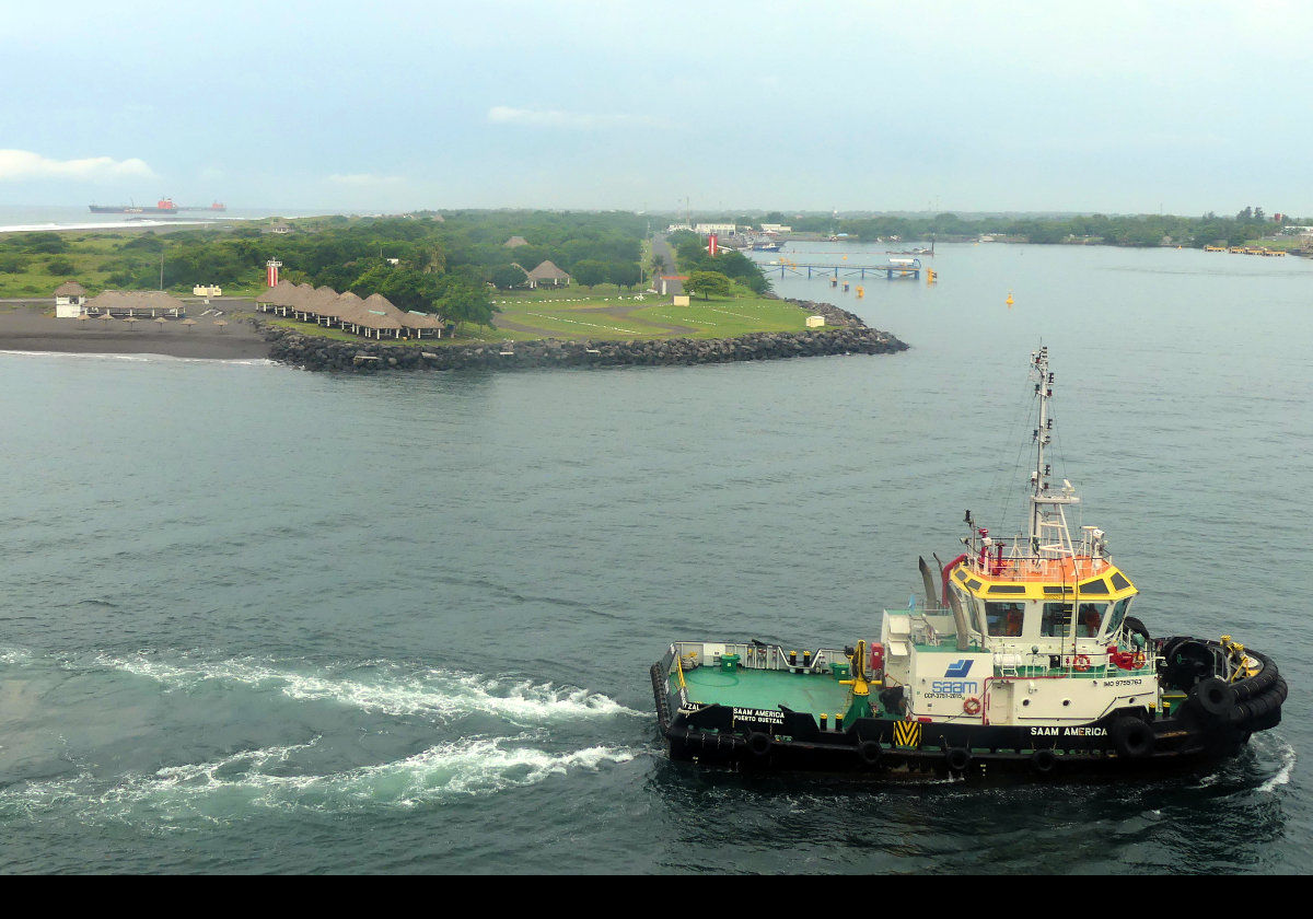 A tugboat guiding us into our mooring.