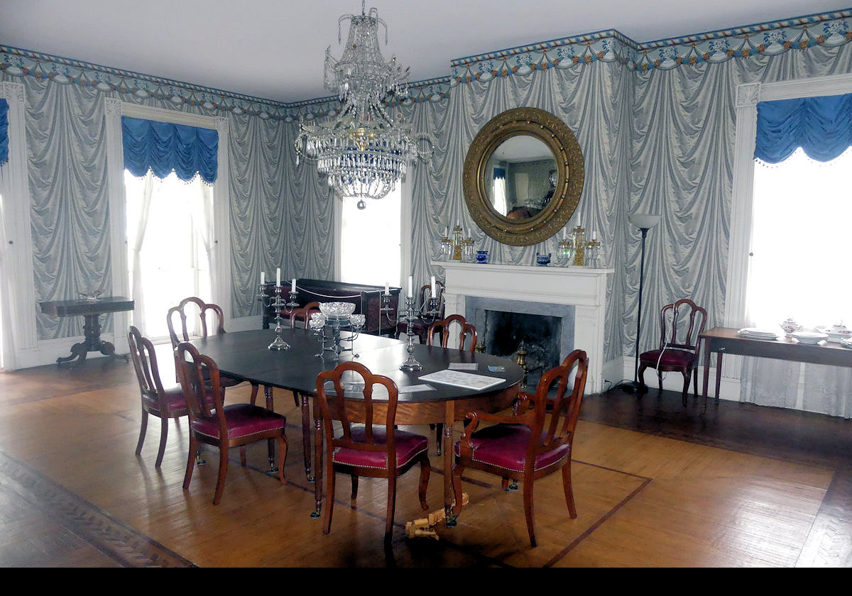 The dining room featuring incredible trompe l'oeil wall paper.  Click the image to see an example of a menu served here for a dinner party.