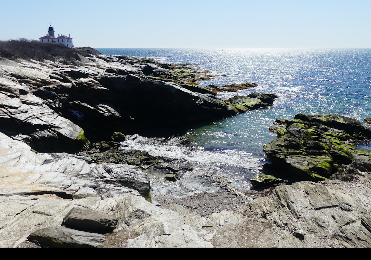 Beavertail Lighthouse in the distance.  Click the image for a closeup.  Many more pictures in the lighthouse sections.